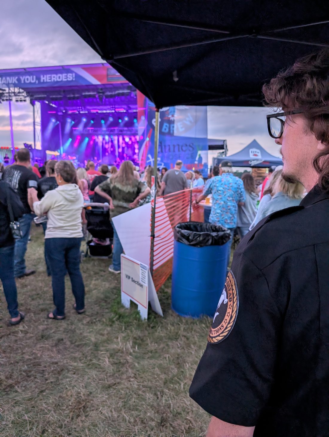 Officer monitoring a VIP section checkpoint at a live event